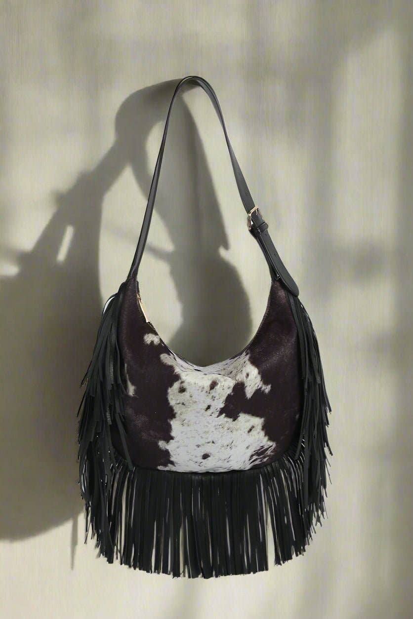 The Paula Faux Suede Cow Print Fringe Hobo Bag