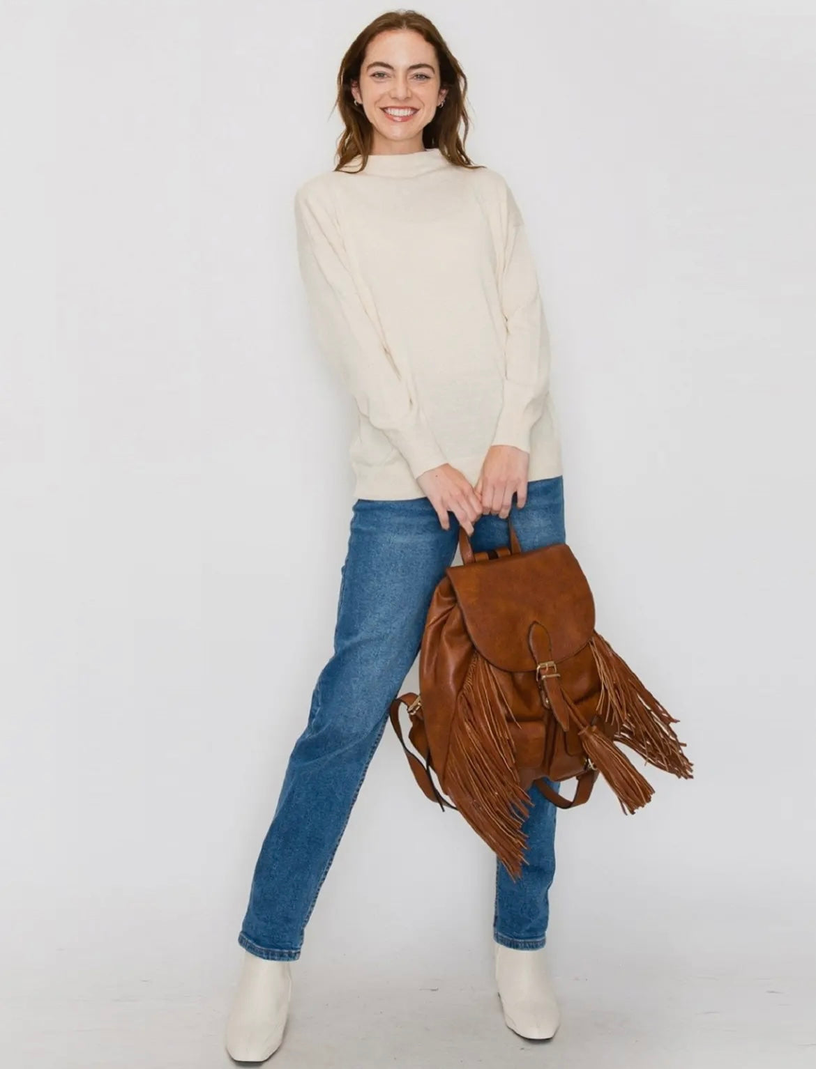 The Double Back Buckle Flap Fringe Backpack