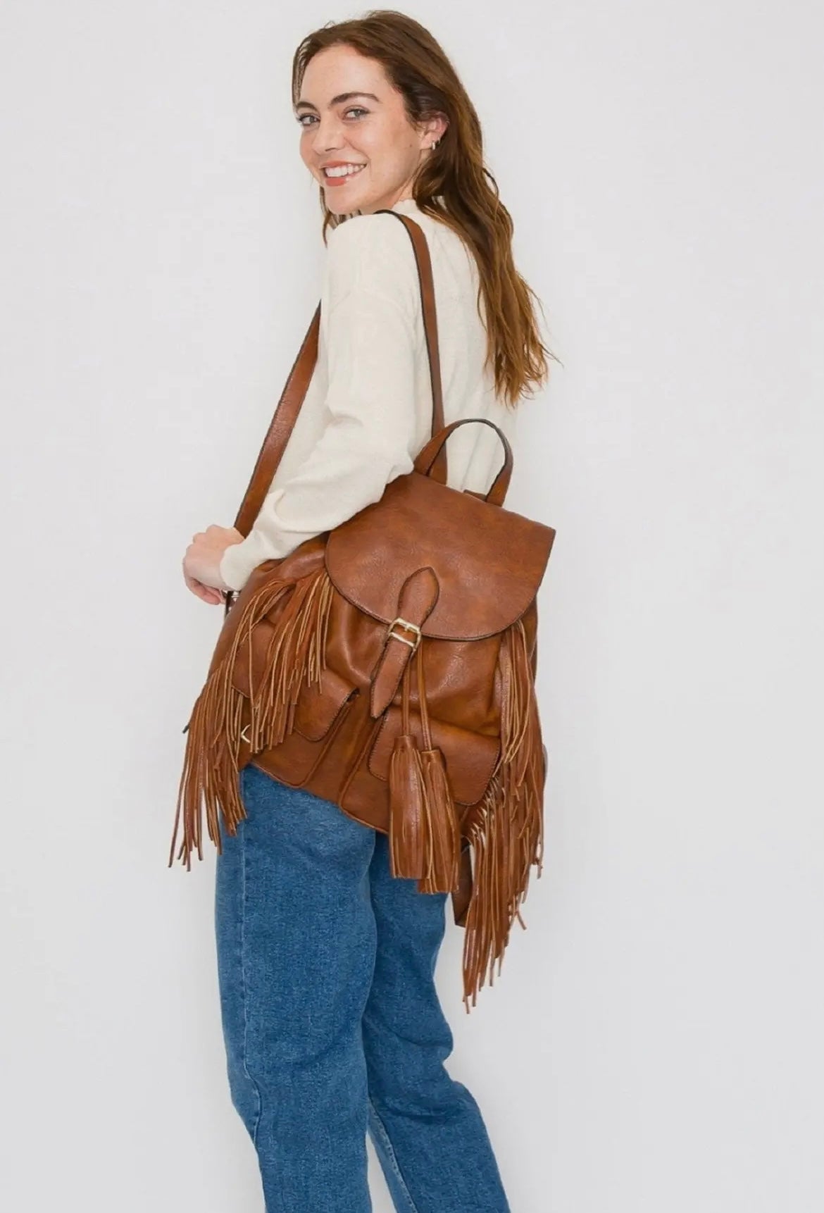 The Double Back Buckle Flap Fringe Backpack